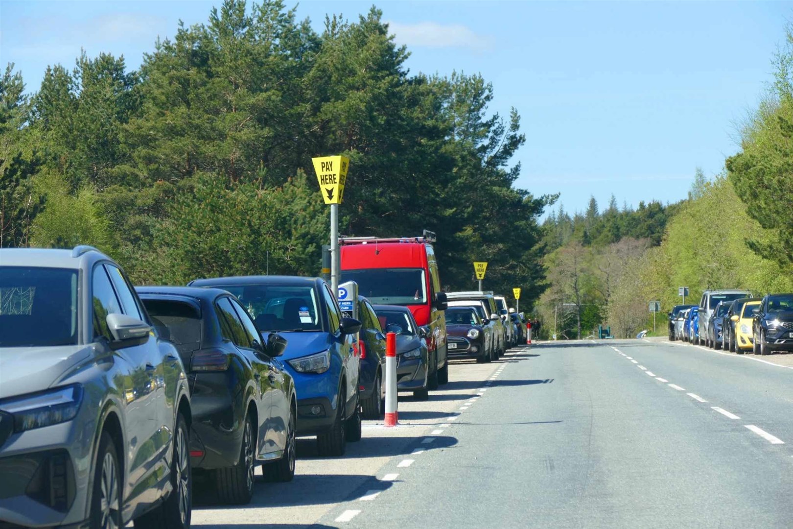 The line of pay and display meters stretches to the Hay Field from around the Reindeer Centre.