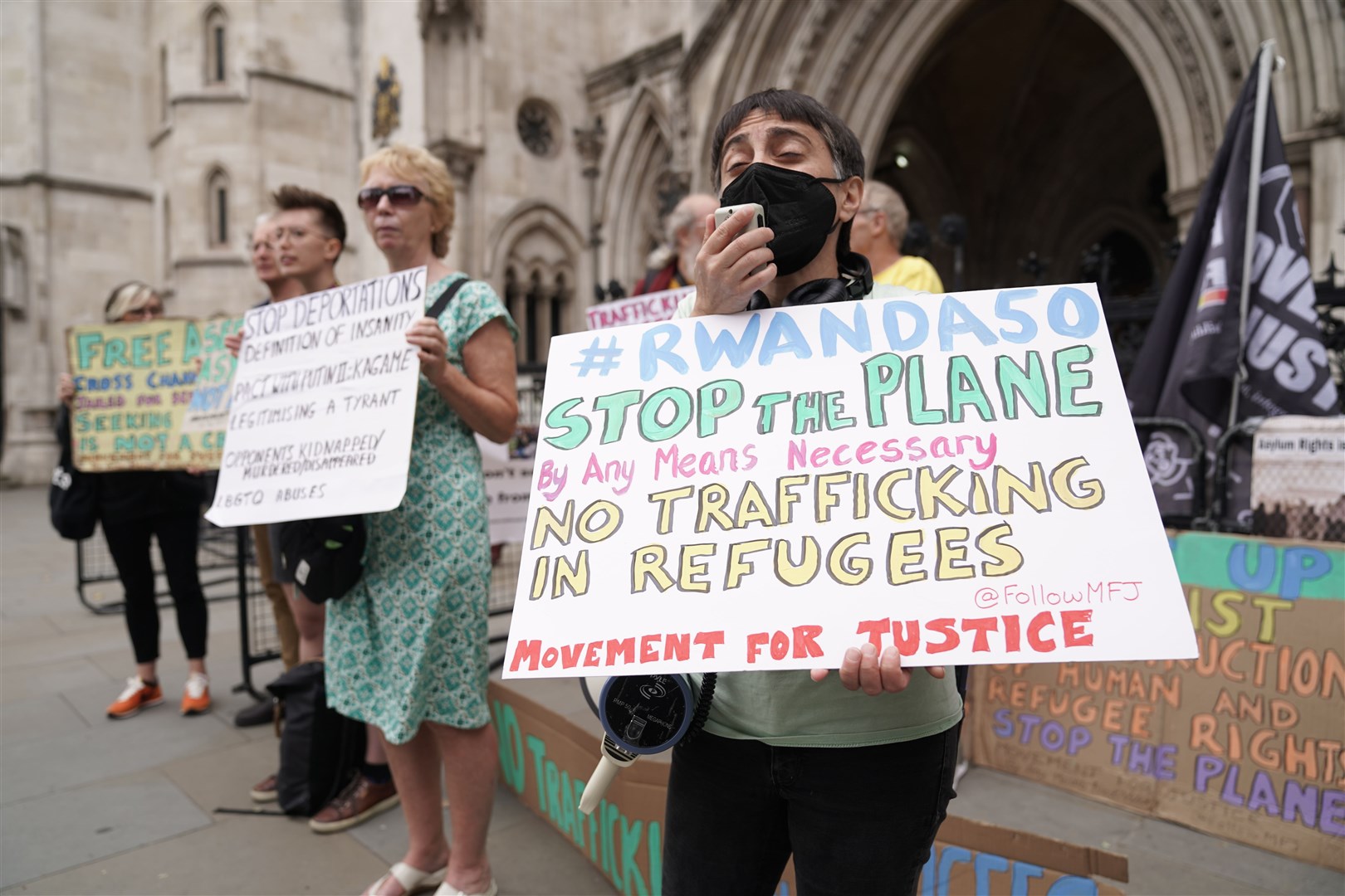 Protesters outside the High Court in London on June 13. The first deportation flight – due to take off the next day – was grounded amid a series of legal challenges (Aaron Chown/PA)