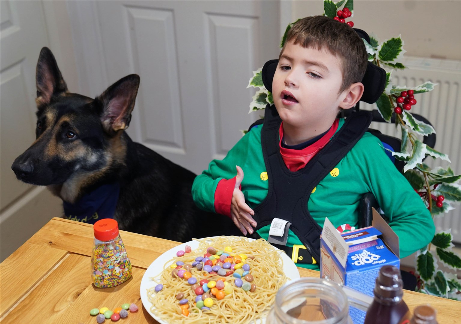 Ms Dodd-Moore said Buddy has helped JJ become more comfortable around strangers (Owen Humphreys/PA)