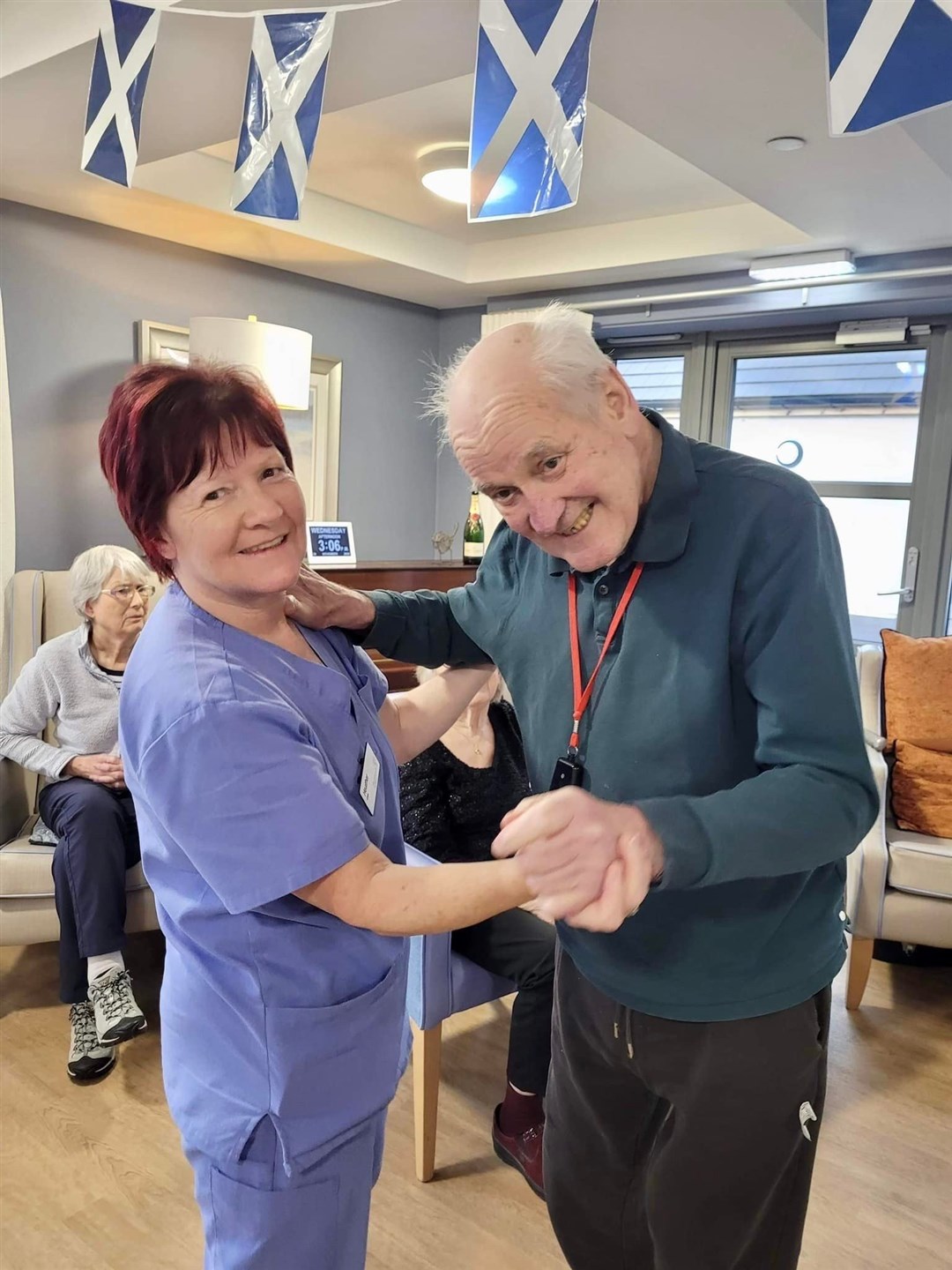 Staff member Heather Docherty and resident Jack Badger enjoy a wee dance.