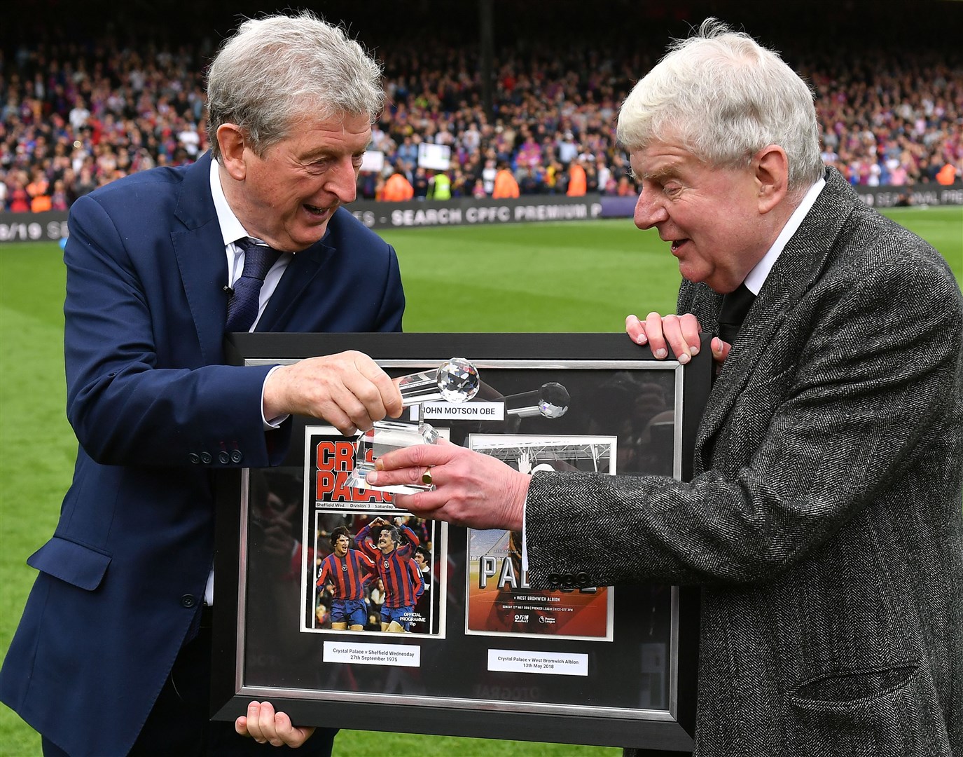 John Motson being presented with an award by Crystal Palace manager Roy Hodgson after the final whistle of his Premier League final commentary (PA)