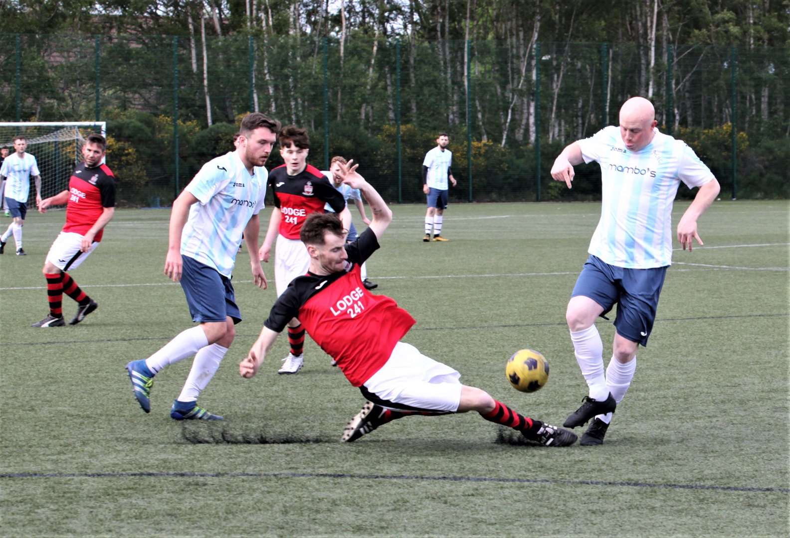 Aviemore’s David Robertson (right) is on the receiving end of a strong tackle on Tuesday night.