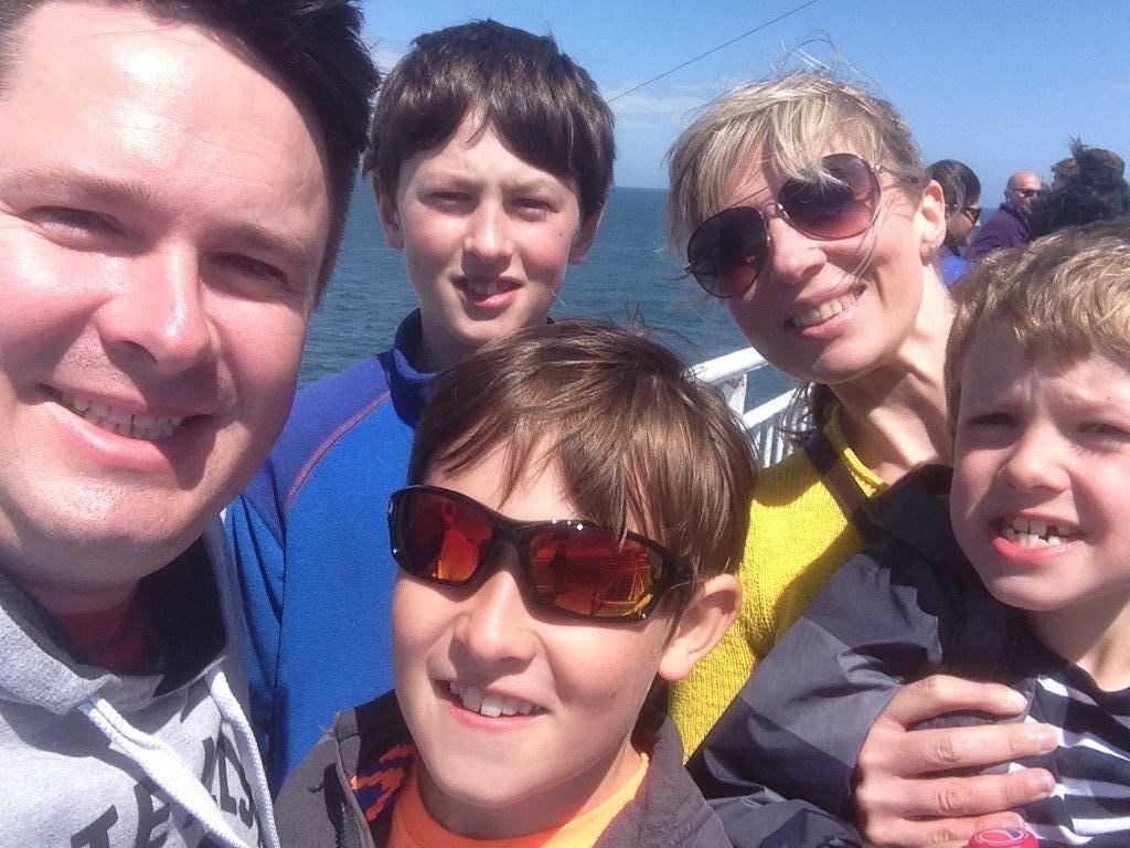 Sally Foulds with husband Greig, and their three sons.
