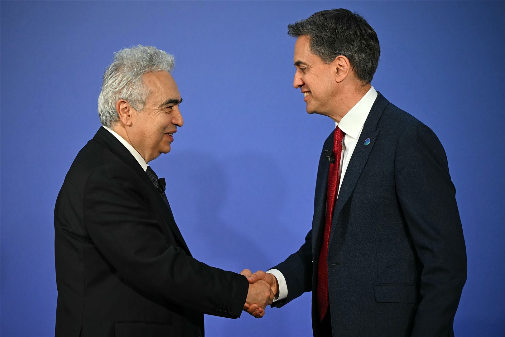 Energy Secretary Ed Miliband greets executive director of the International Energy Agency Fatih Birol (Justin Tallis/PA)