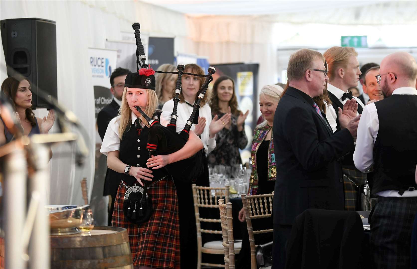 A piper pipes principal guests to their table.Picture: Becky Saunderson
