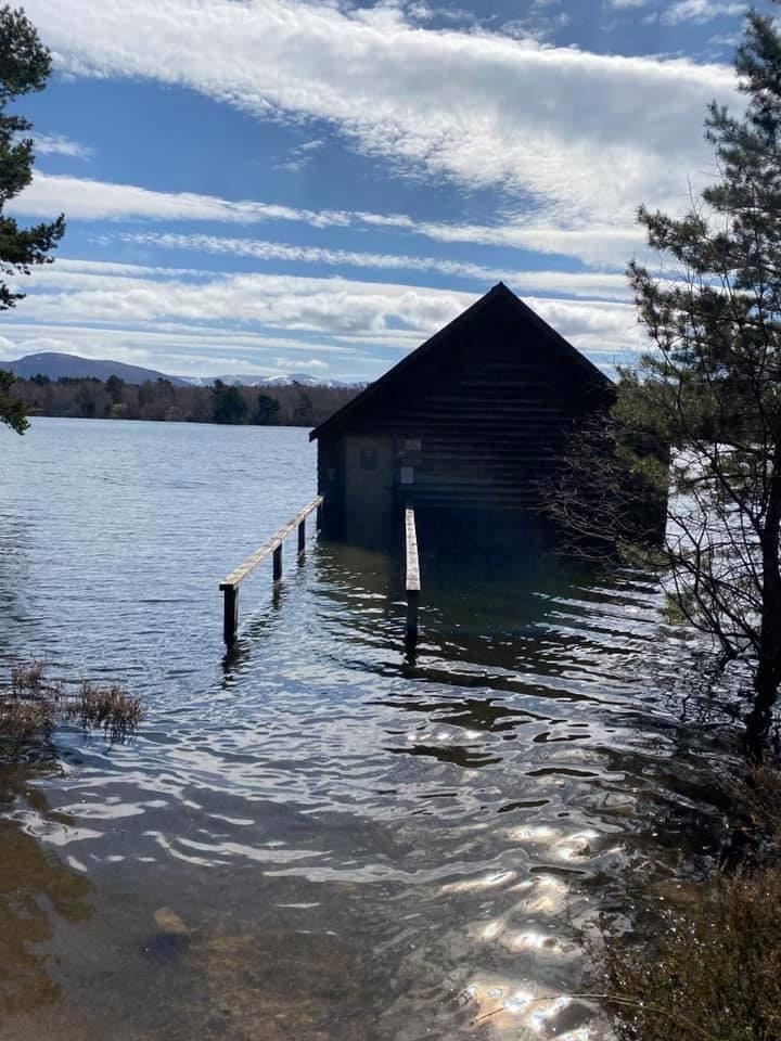 The walkway leading to the boathouse is submerged well beneath the water.