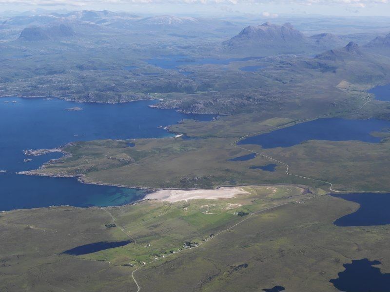 General oblique aerial view looking over Achnahaird Bay towards Suilven (left), Stac Pollaidh (right) and Cul Mor, taken from the west. Picture: © Crown Copyright: Historic Environment Scotland.