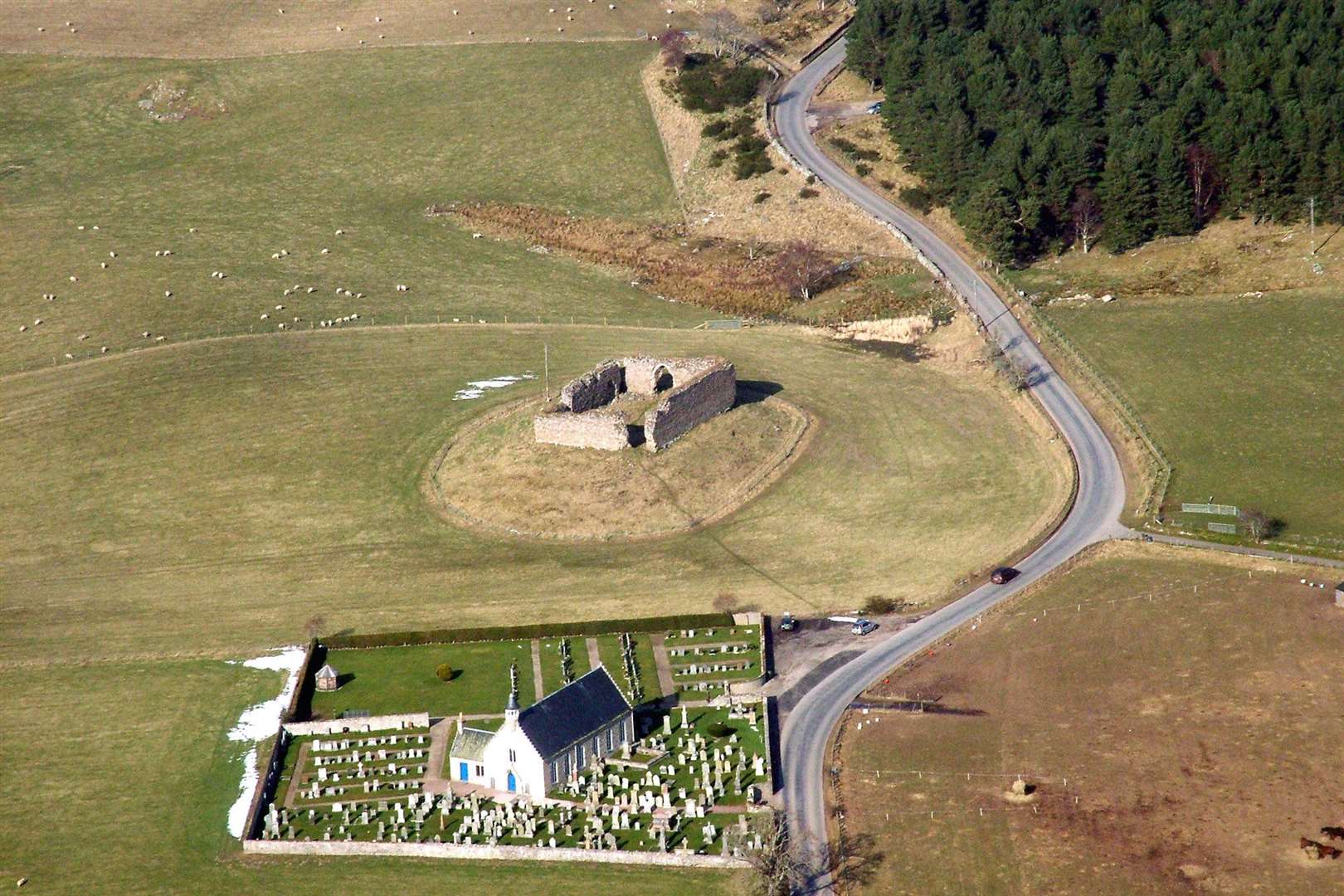An aerial view of Castle Roy and the old kirk.