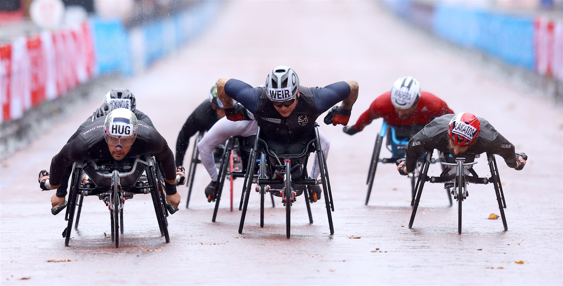 Racing down The Mall (Richard Heathcoate/PA)