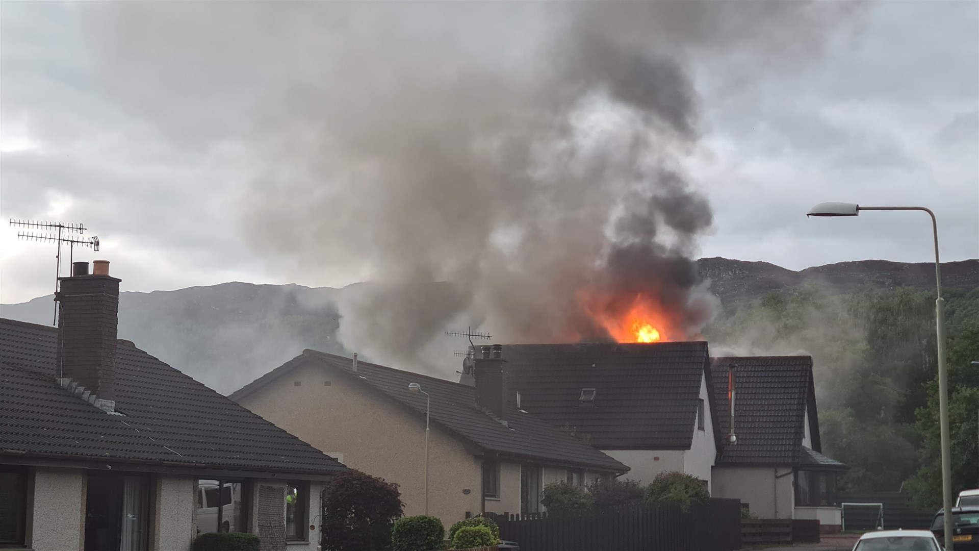 Flames could be seen coming from the roof of the property.