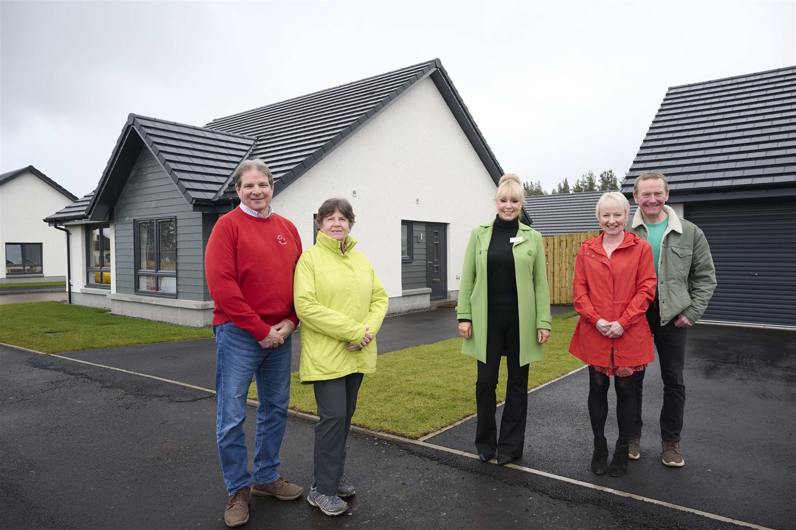 At the new homes are Jim Lachendro and Anne Sutherland; sales consultant Jacqui O’Rourke and Richard and Caroline Bell.