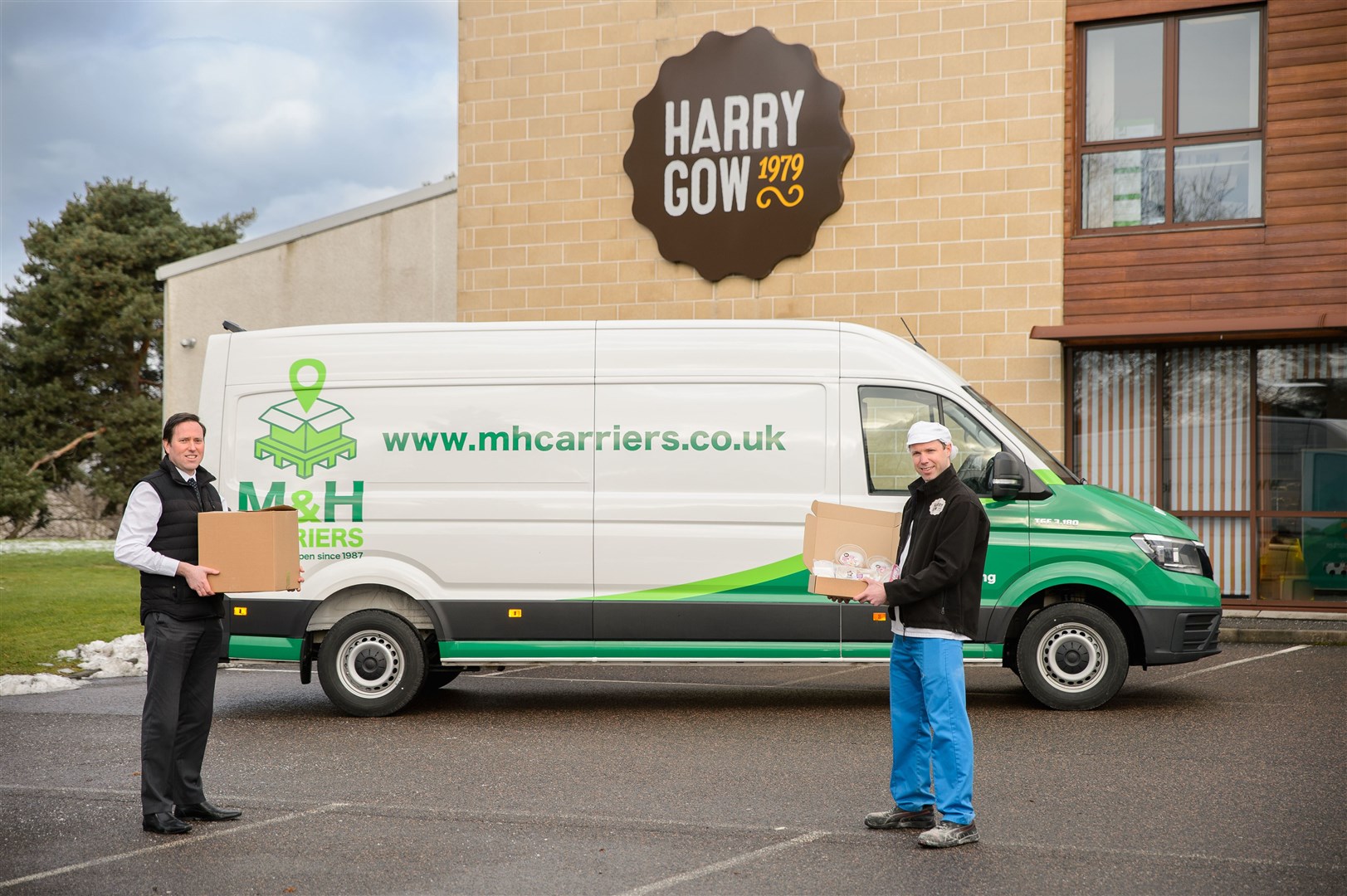 M&H Carriers’ Fraser MacLean (left) joins Harry Gow’s Fraser Gow to celebrate the expansion of the Harry’s at Home service.