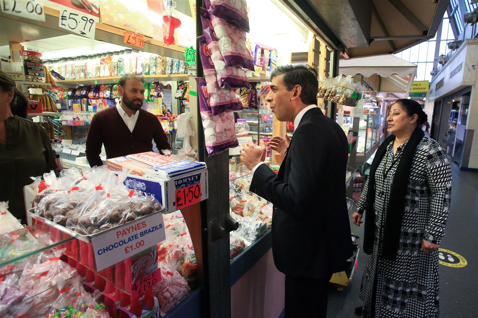 Chancellor Rishi Sunak at a sweet shop during a visit to Bury market (Lindsey Parnaby/PA)