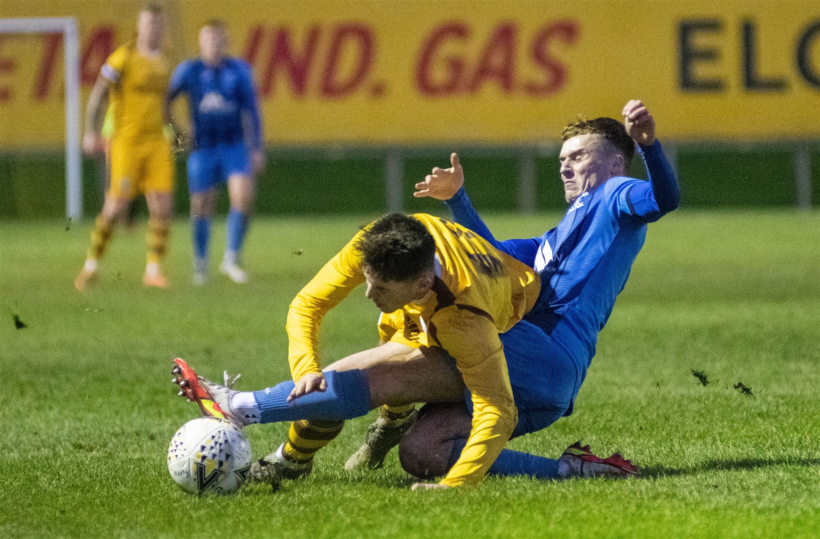 Strathspey's Liam McDade goes in for a challenge on Forres Mechanics' Thomas Brady...Forres Mechanics FC (8) vs Strathspey Thistle FC (1) - Highland Football League 22/23 - Mosset Park, Forres 07/01/23...Picture: Daniel Forsyth..