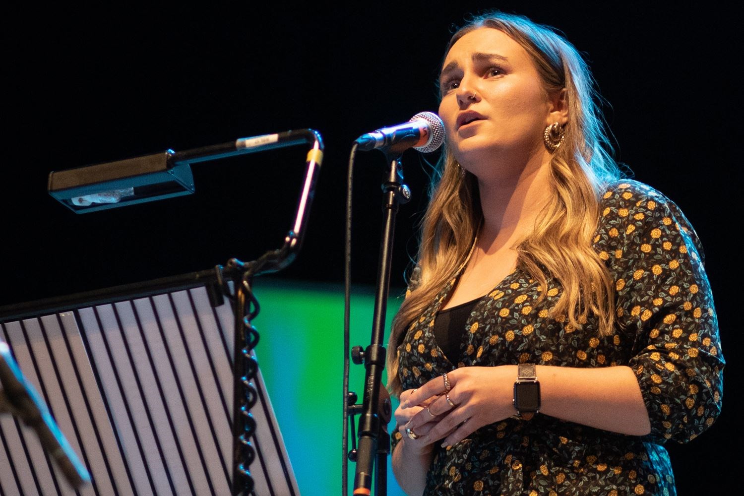 Picture shows Emma MacLeod singing on stage during a performance of East - Lauren MacColl presented her newly commissioned work, ‘An Ear / East’ at The Royal National Mòd at Eden Court in Inverness 12/10/21. The local fiddler and composer performed a piece inspired by coastal happenings and stories from around the Moray Firth as part of the celebrations for Scotland’s Year of Coasts and Waters and was joined by fellow musicians Mairearad Green, Anna Massie and Rachel Newton with songs from Arthur Cormack and Emma MacLeod and Ali Levack playing pipes. The concert also featured exciting visuals by filmmaker Zoe Paterson MacInnes.