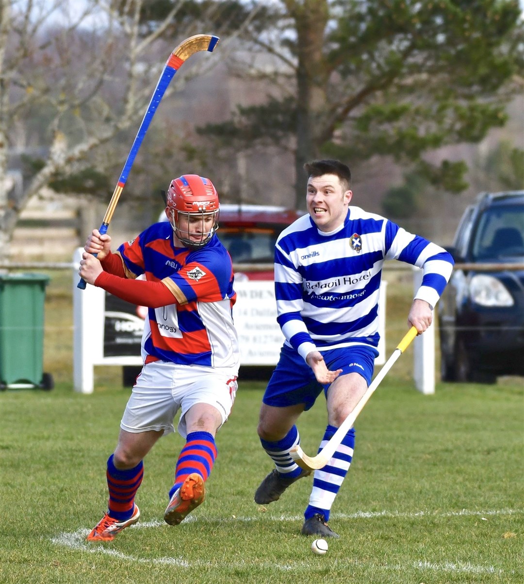 Savio Genini in action against Newtonmore's Steve MacDonald.