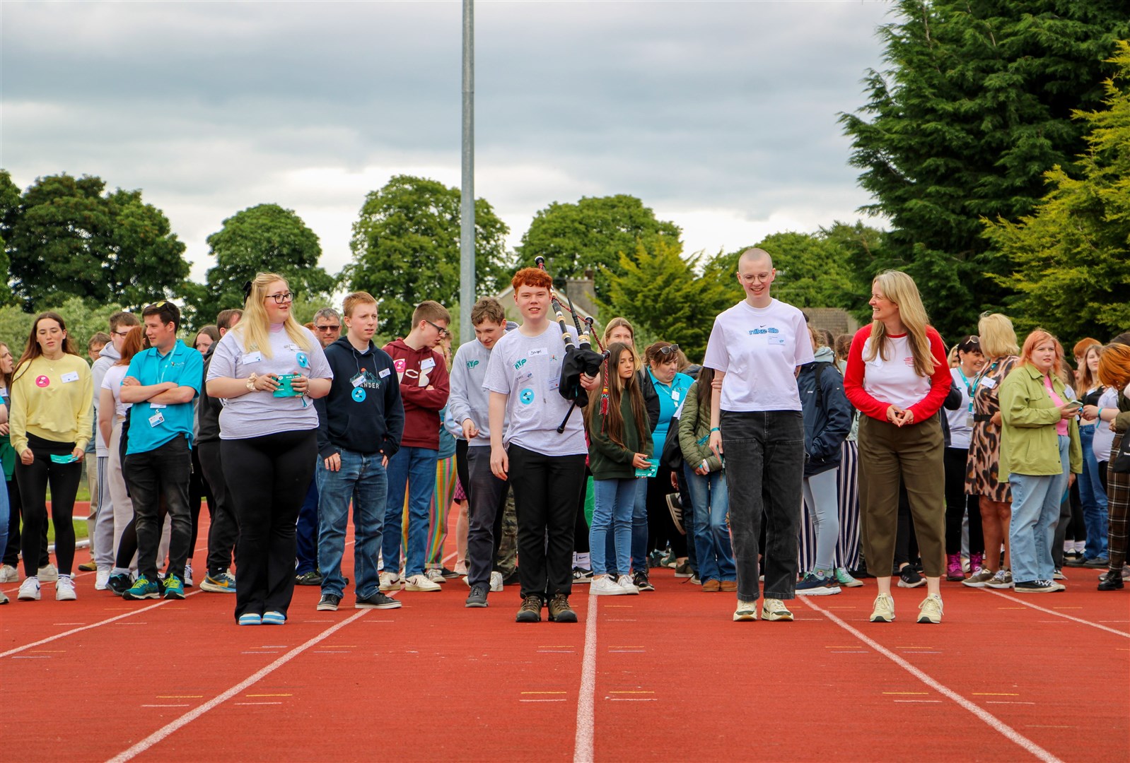 2024: Pictured leading the Walk a Mile for Mental Health are (from left to right) Megan Travers, Chair of Highland Youth Parliament (from Wick); Dougal Masterson, piper and vice-chair of the Highland Youth Parliament (Dingwall); Orla MacLeod, Highland Youth Convener (Skye); and Nicola Killean, Children and Young People’s Commissioner.