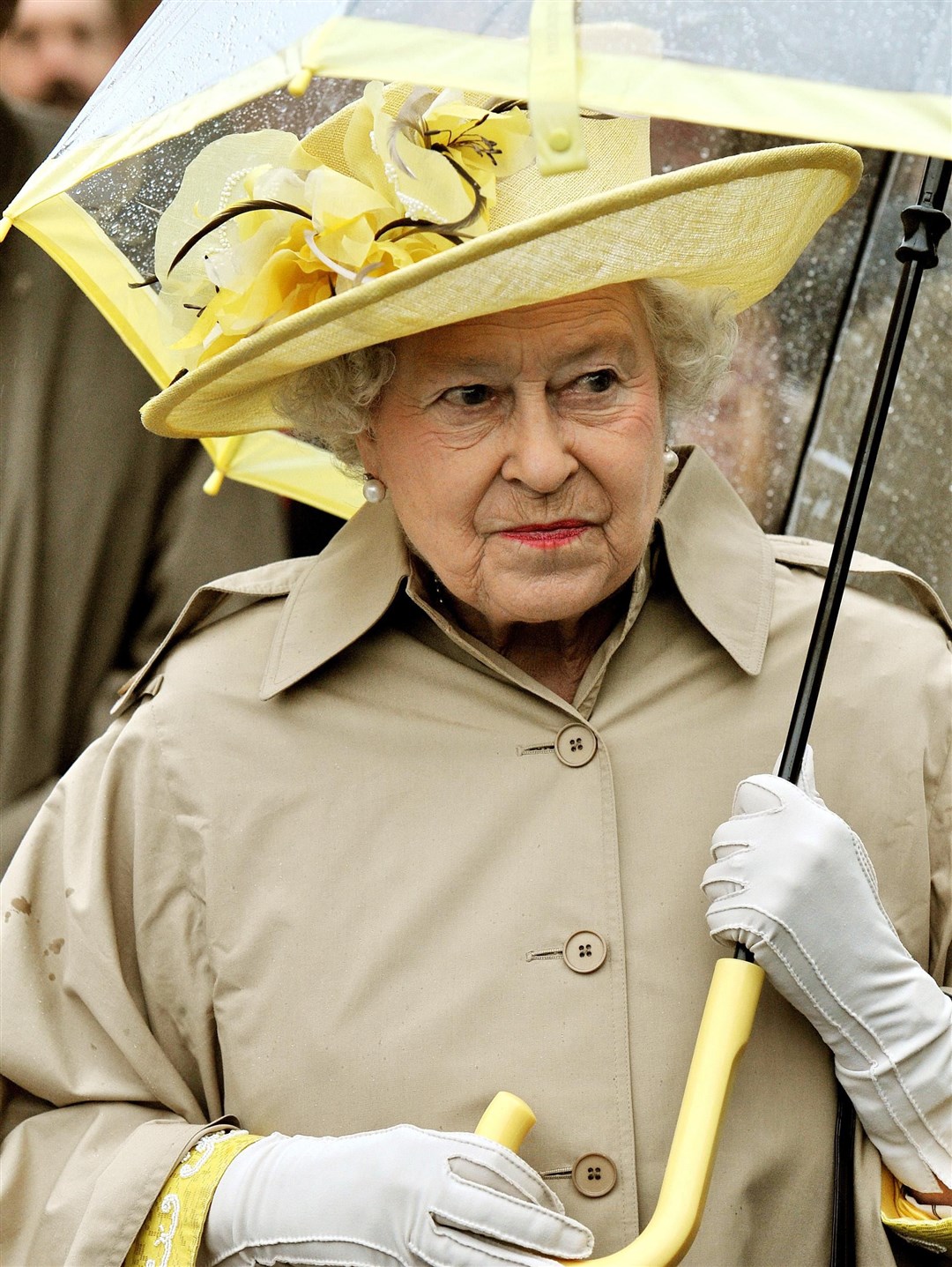 The Queen matches her umbrellas to her outfits (John Stillwell/PA)