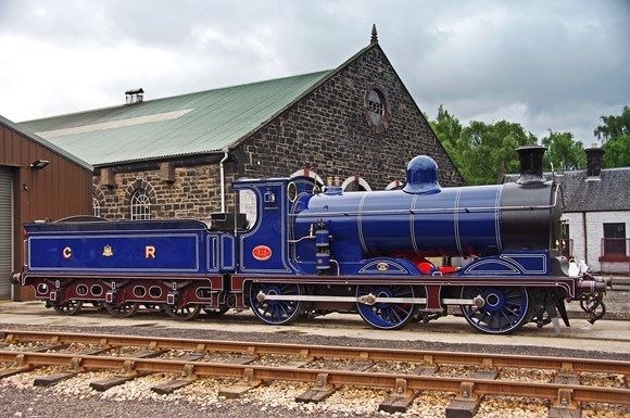 One of the company's engines in front of the listed locomotive shed.