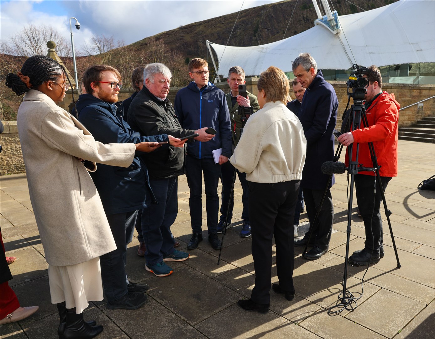 Nicola Sturgeon was surrounded by members of the media as she arrived at Holyrood on Wednesday after announcing her decision (Robert Perry/PA)