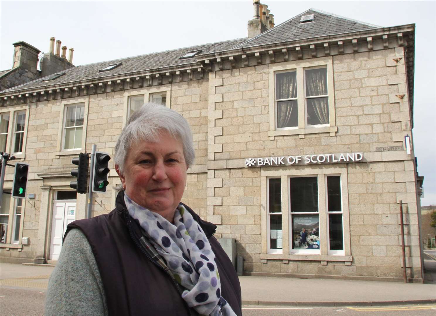 Grantown Community Council chairwoman Linda Coe pictured outside of the Bank of Scotland branch in The Square in April when the branch was reprieved.