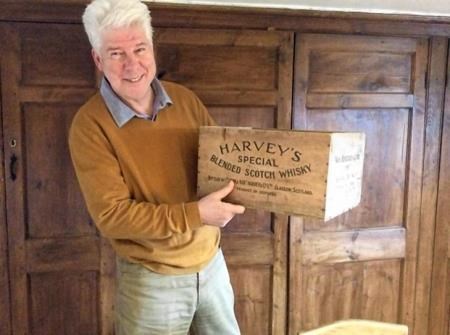 Mr John Harvey McDonough with one of the wooden boxes from Harvey's of Edinburgh which appeared in the original movie