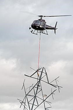 Steel Pylon structure is flown out of Lettoch Farm, Nethy Bridge