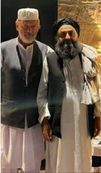 Peter Jouvenal, left, with Mullah Hafezullah in November (Peter Jouvenal/PA)