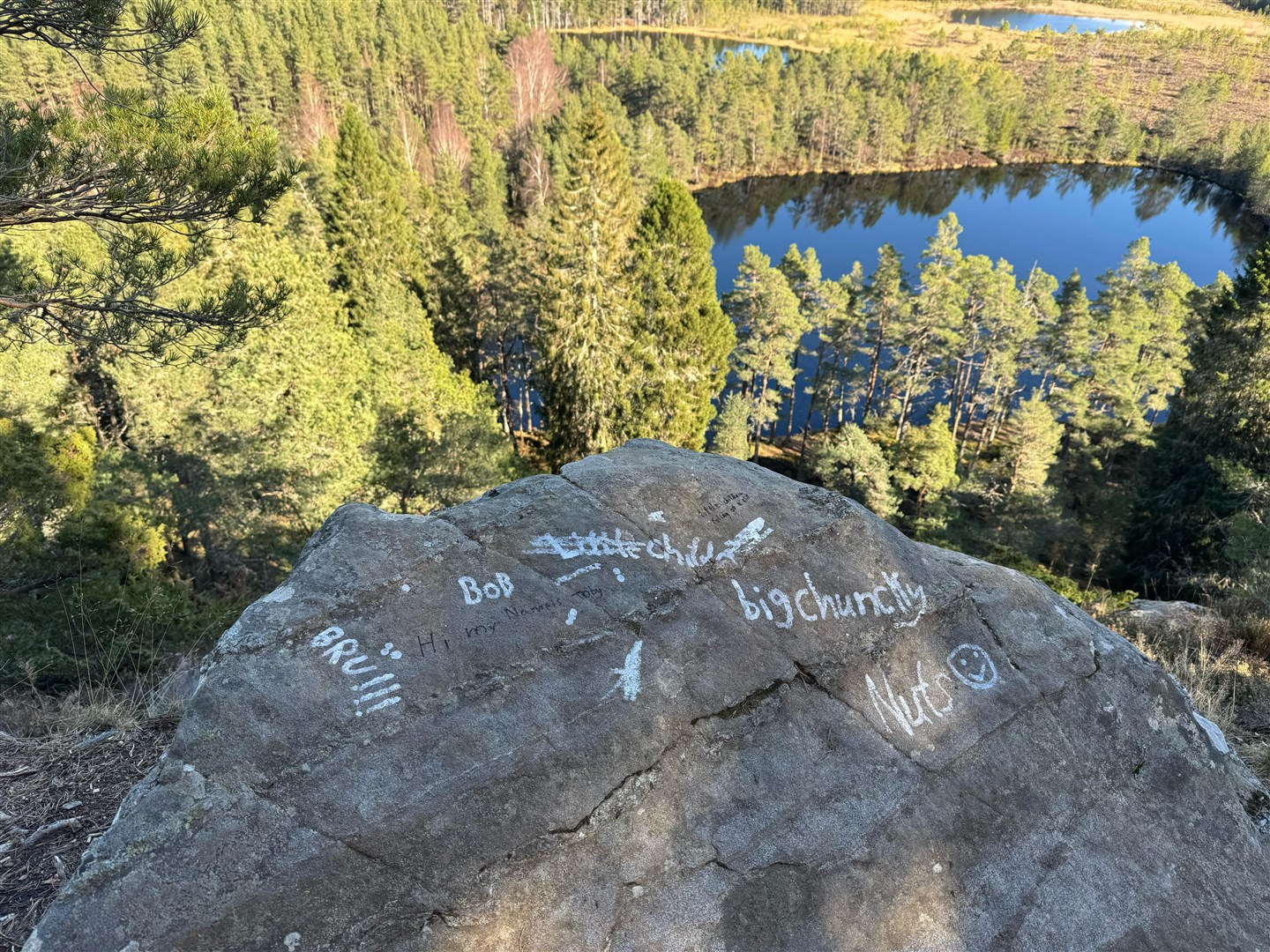 The graffiti scrawled on the big boulder overlooking Uath Lochans. Picture: James Stevens.