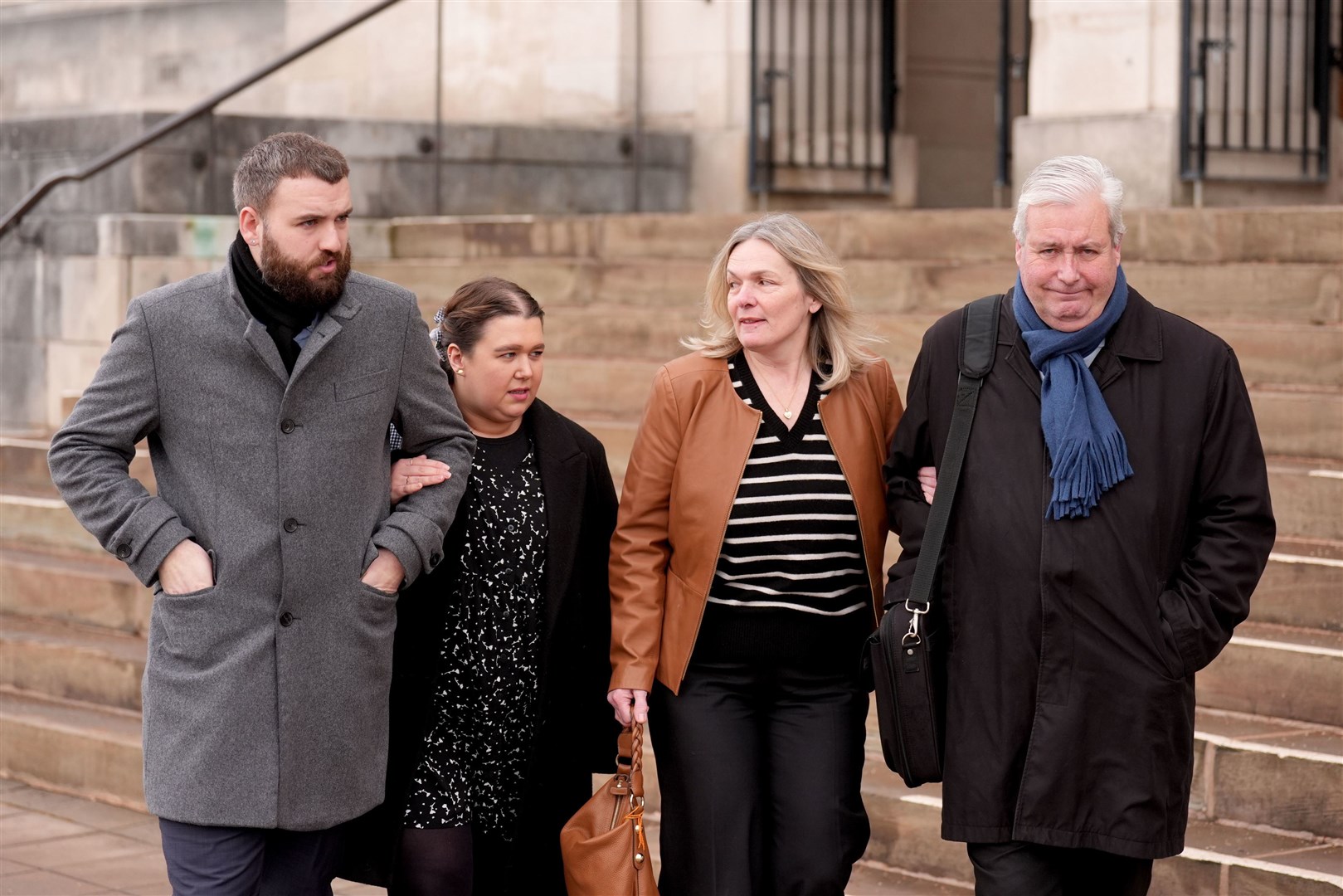 Maddy Cusack’s brother Richard with his partner Emily Baker, and her parents Deborah and David Cusack (Joe Giddens/PA)