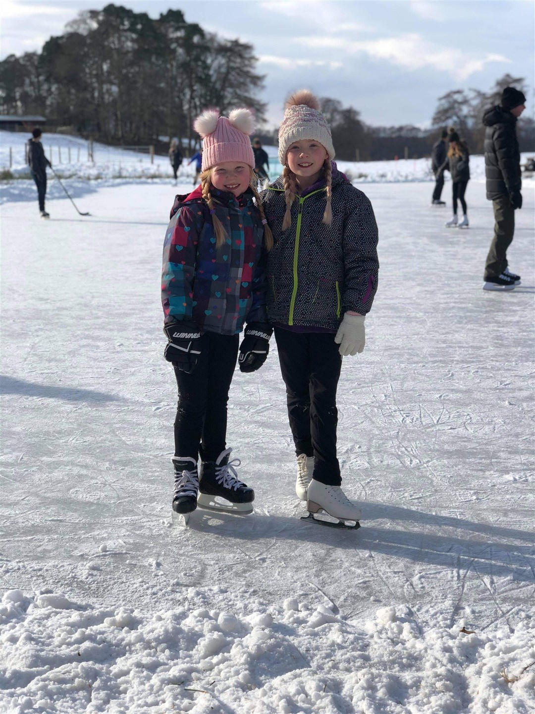 Aviemore sisters Amy and Ellie Macleod enjoying the natural ice at a rink created by Rothiemurchus and Aviemore Tennis Club during this year’s freezing spell.