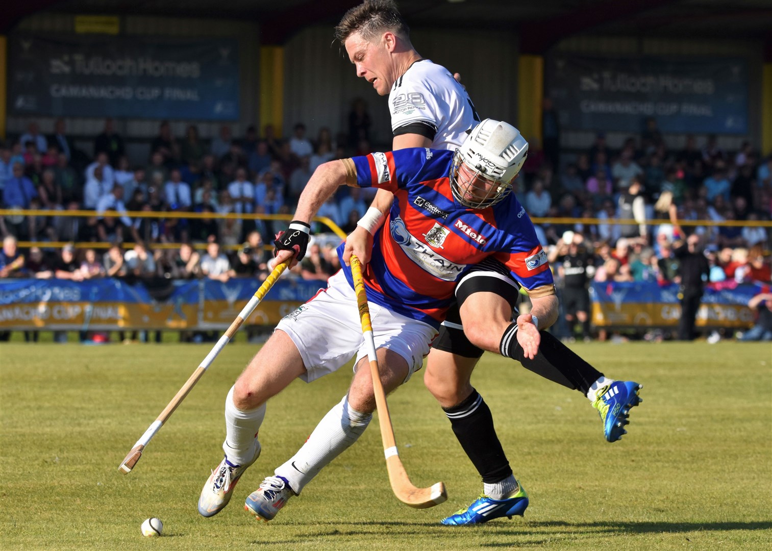 Man of the match Ruaridh Anderson and Lovat's Martin Mainland in combat. Picture: Fiona Young.
