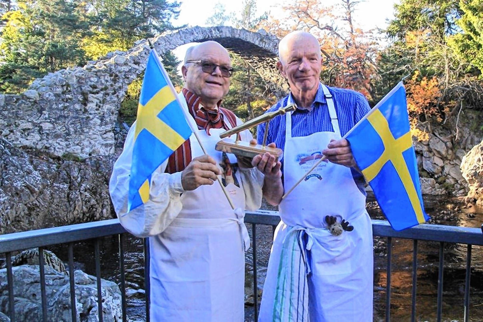 This year's world porridge champs has a very different format compared to other years due to the pandemic. Pictured are 2018 winners Calle Myrsell and Per Carlsson from Sweden in front of the village's old packhorse bridge.