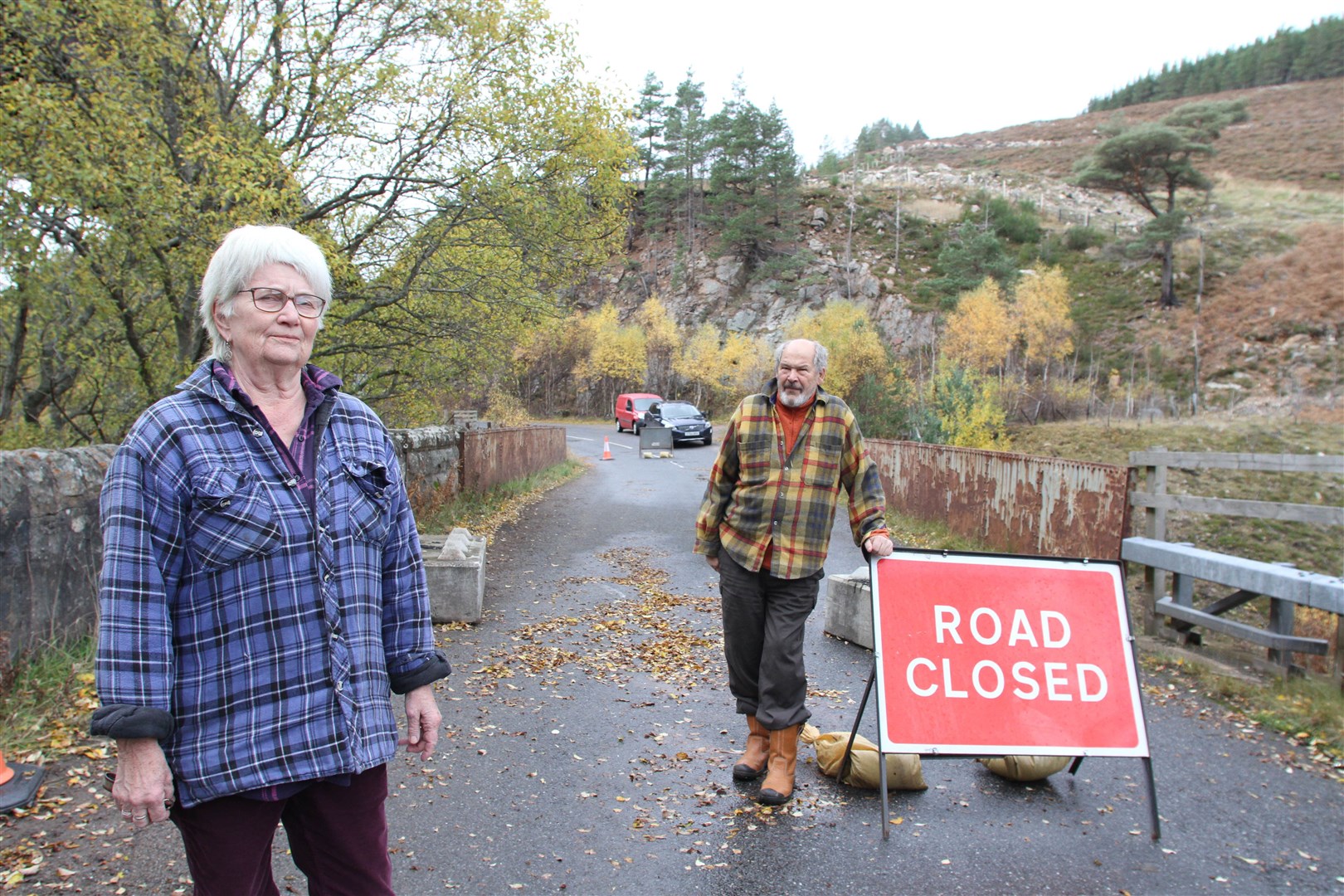 Liz and Ian Bishop at the blocked off approach to Sloch Cottages Bridge.