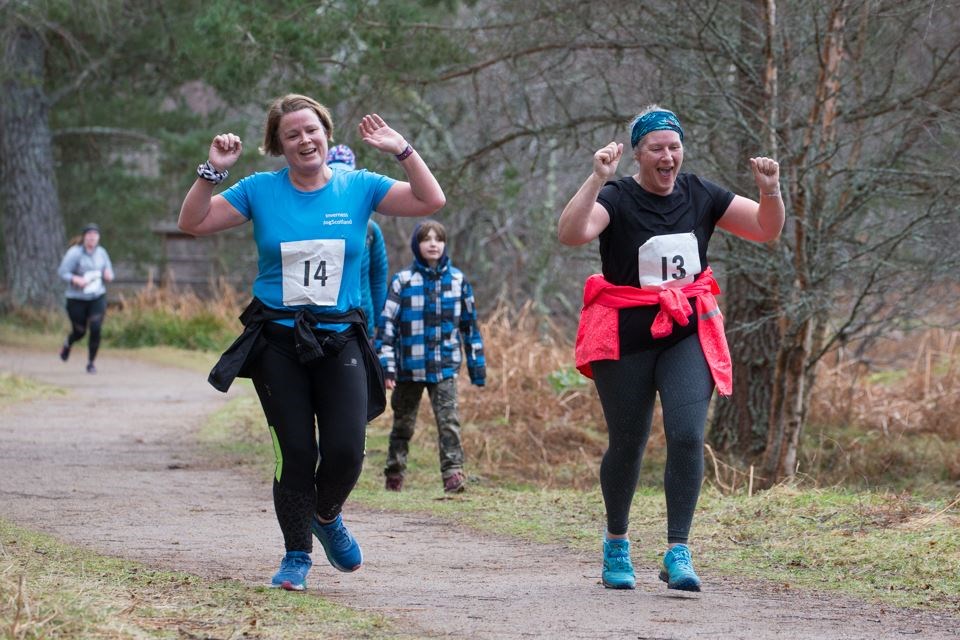 Runners raise their arms at Saturday's Loch Morlich Running Festival. Pictures: Fitnessat58degreees