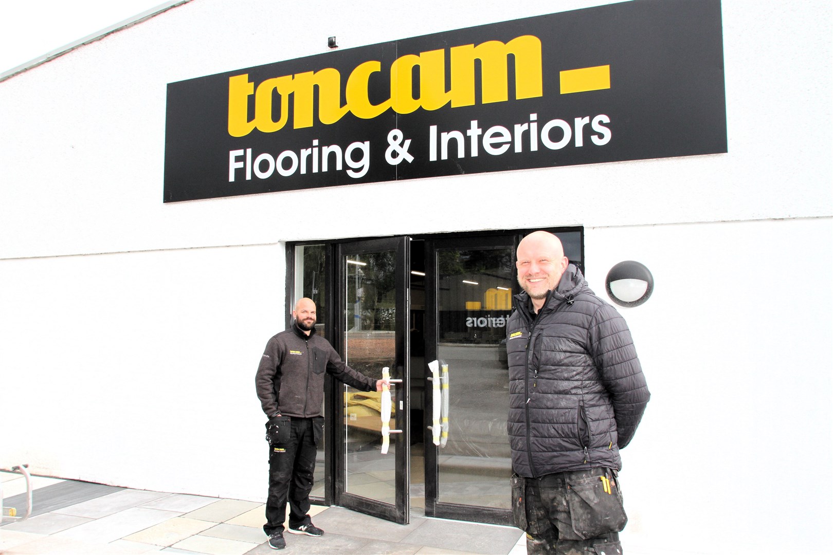 Evan Menzies prepares to open the doors for Sunday's big launch, with colleague Scott Campbell waiting to help with the warm local welcome.