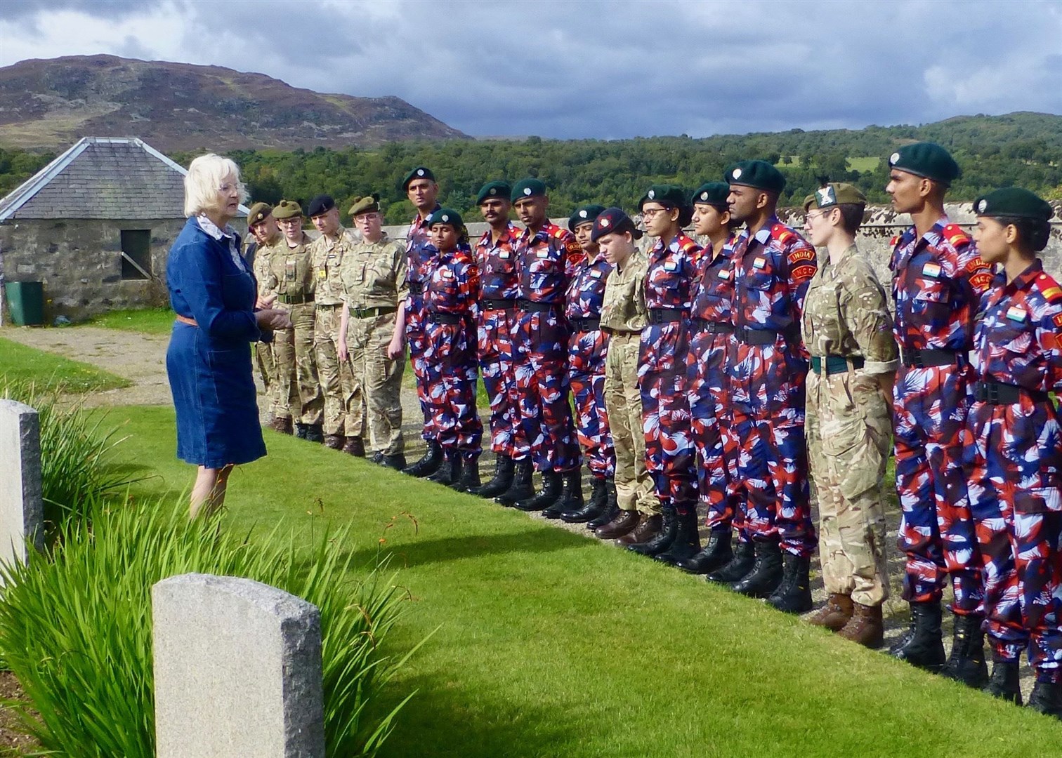 Mrs Gaynoll Craig, daughter of Isobel Harling BEM, addresses the cadet grouop at the New Cemetery
