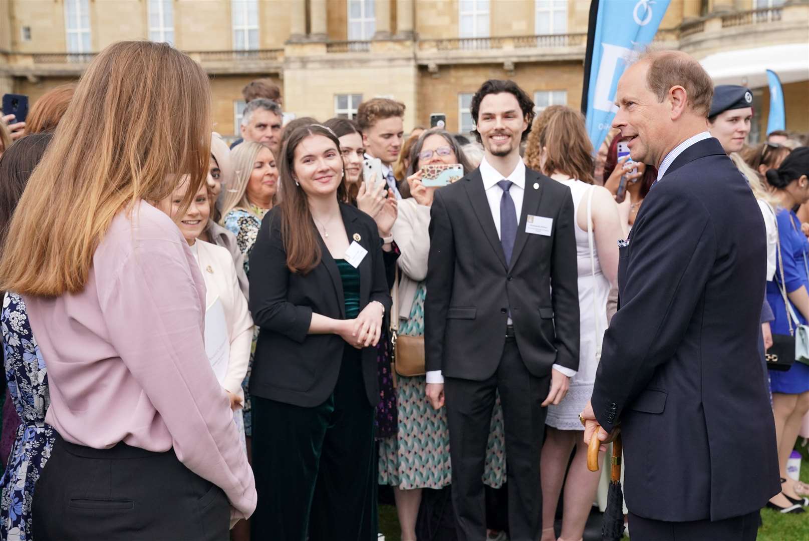Edward meets Duke of Edinburgh gold award holders and their families in the palace garden (Jonathan Brady/PA)