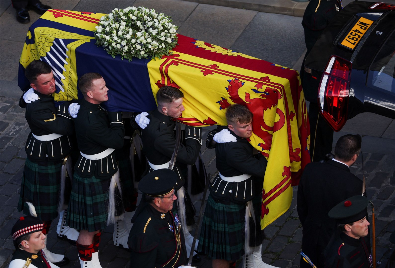 Royal guards carry the Queen’s coffin as it arrives at St Giles’ Cathedral in Edinburgh (Russell Cheyne/PA)