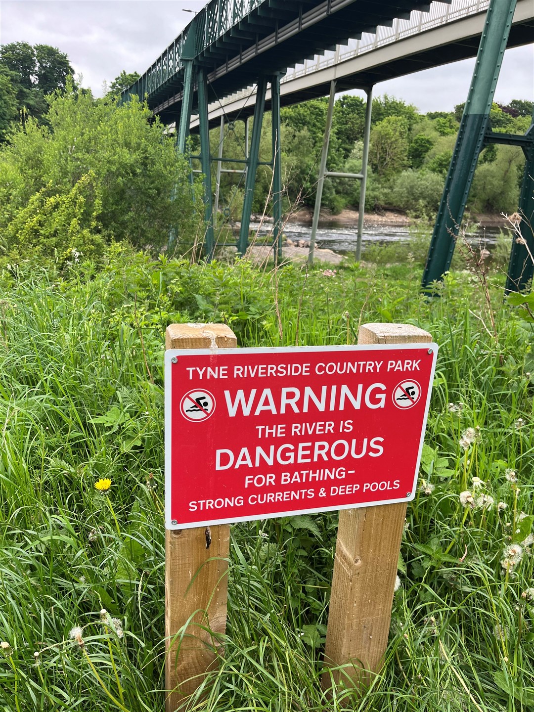 A sign on the opposite Prudhoe side of the River Tyne at Ovingham (Tom Wilkinson/PA)