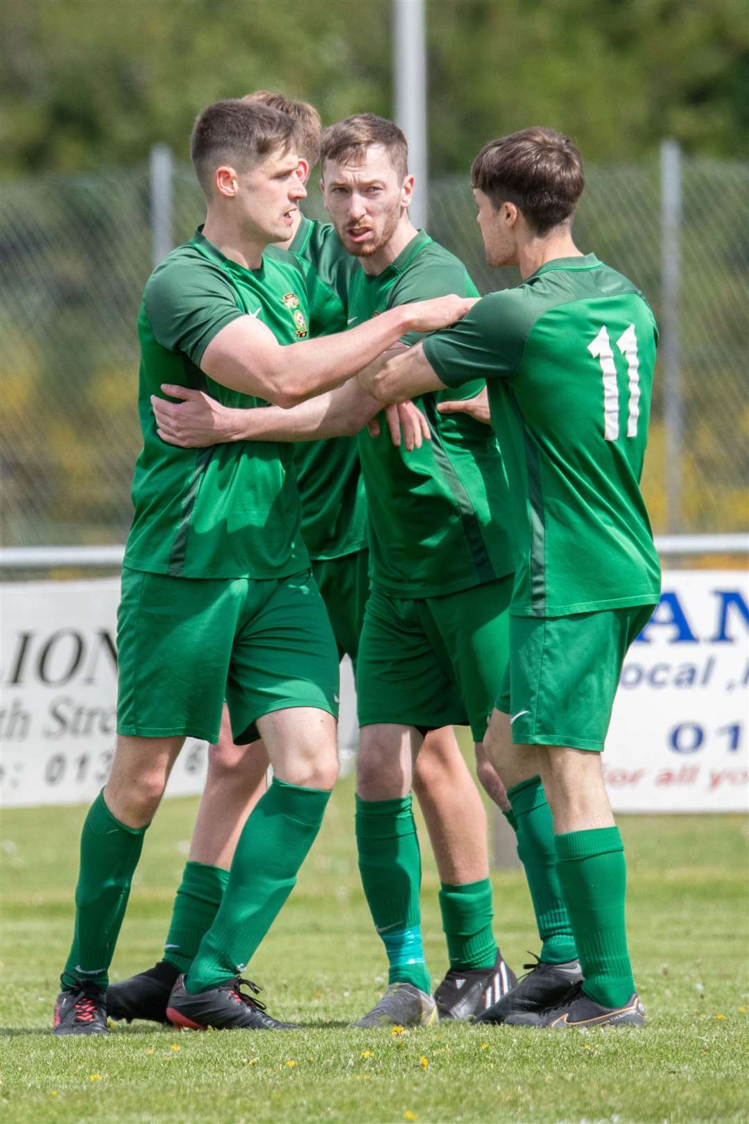 Dufftown's Ben Cullen (centre) celebrates the opening goal. ..Dufftown FC (2) vs Forres Thistle FC (2) - Dufftown FC win 5-3 on penalties - Elginshire Cup Final held at Logie Park, Forres 14/05/2022...Picture: Daniel Forsyth..