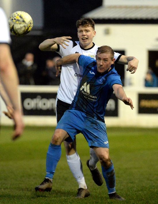 Jags forward Kris Duncan gets in ahead of his marker Michael McRobert.