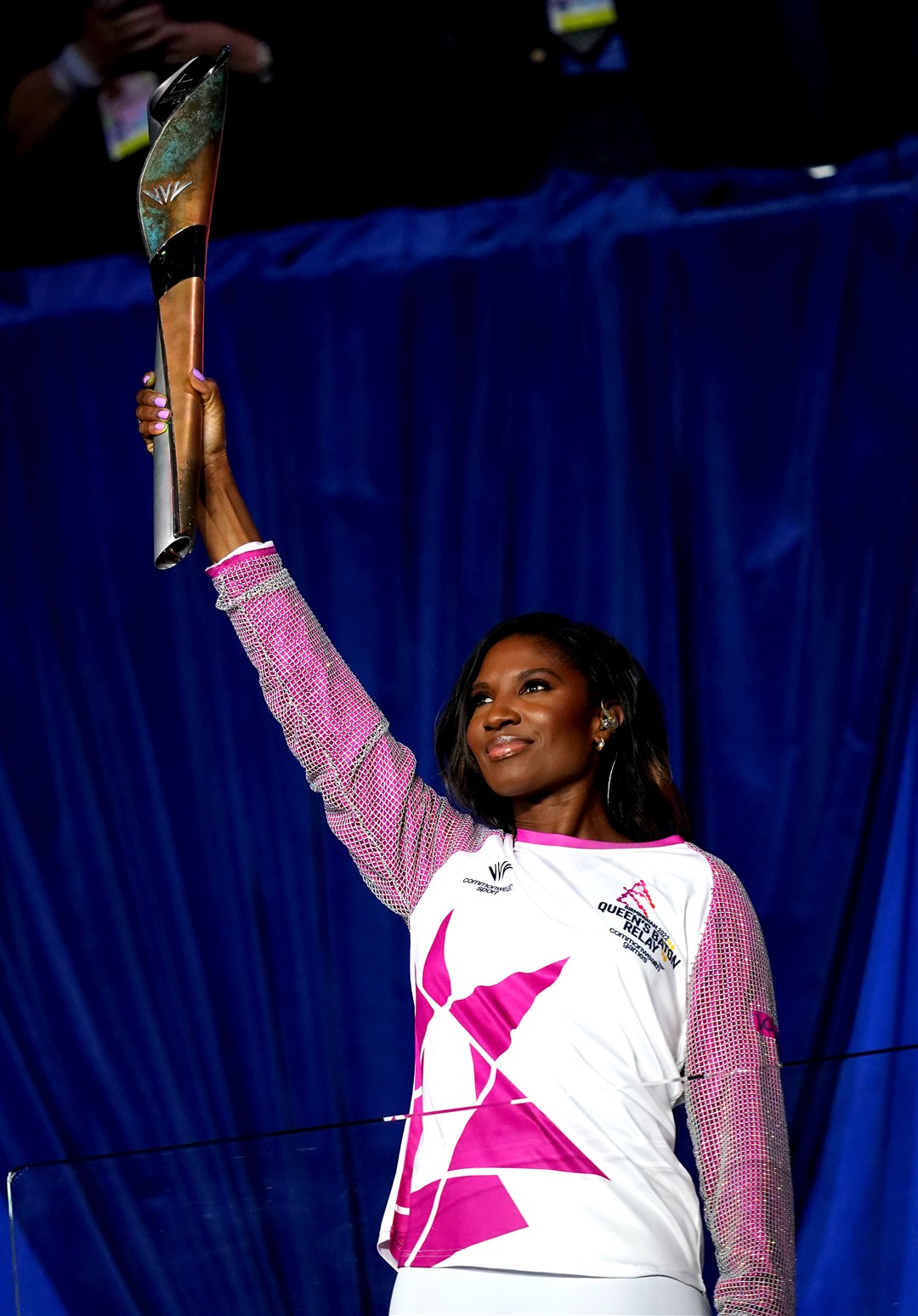 Denise Lewis carries the baton during the opening ceremony of the Birmingham 2022 Commonwealth Games (PA)