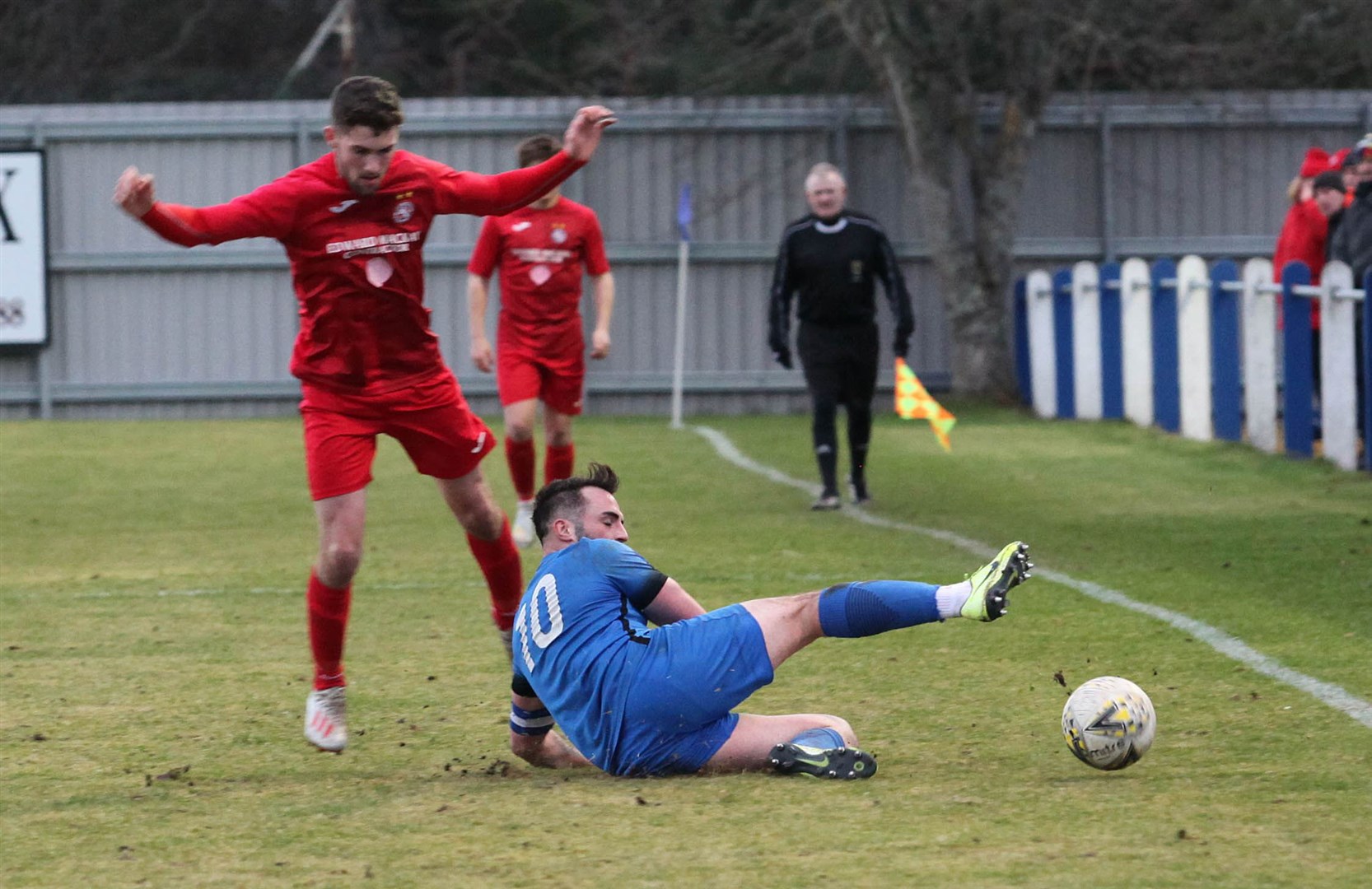 Strathspey Thistle's James Fraser slides in.