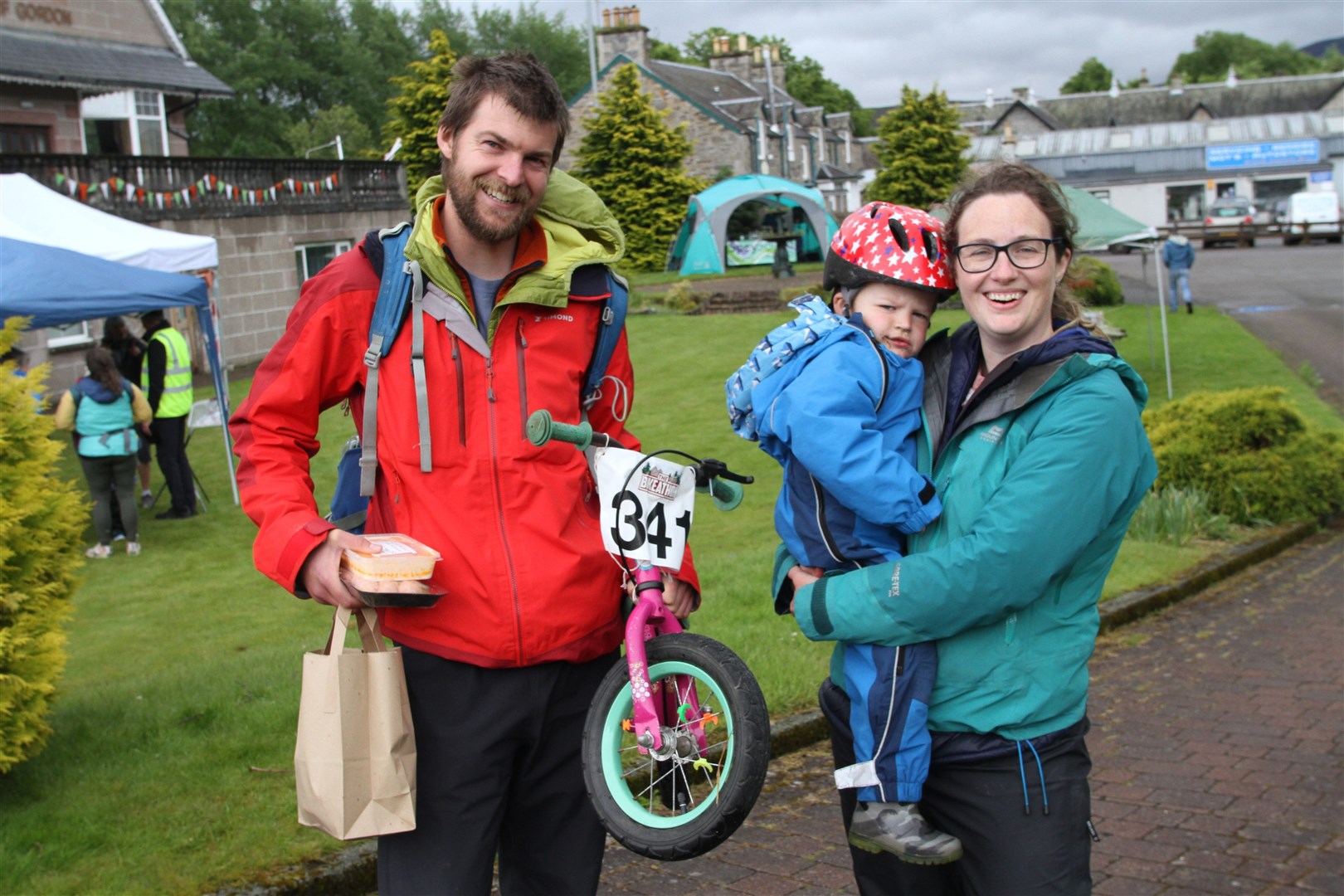 BALANCING THE BIKES: First back from the balance course - Charlie Murrell (2) with mum and dad Bradley and Jenny.