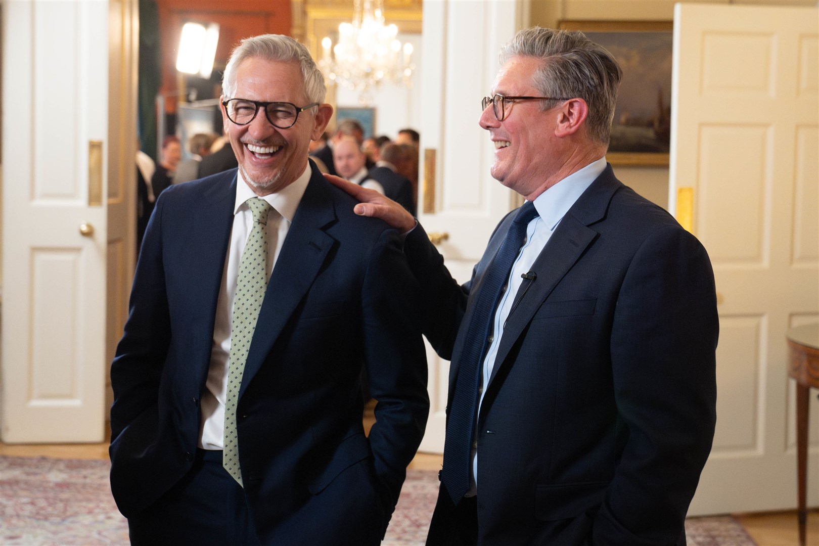 Sir Keir Starmer laughing with Gary Lineker during a reception to celebrate St George’s Day (Stefan Rousseau/PA)