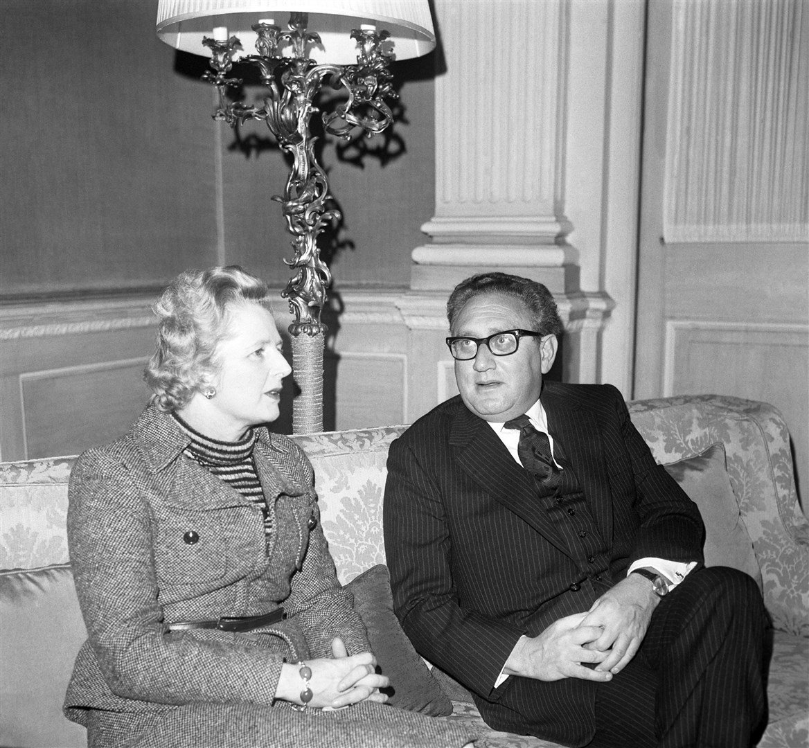 Then-leader of the opposition Margaret Thatcher having breakfast with Mr Kissinger in February 1975 (PA)