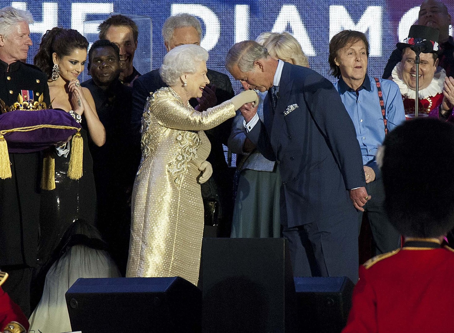 The Queen is greeted by her son, the Prince of Wales, as she joined performers at the end of the Diamond Jubilee Concert at Buckingham Palace (David Parker/Daily Mail/PA)