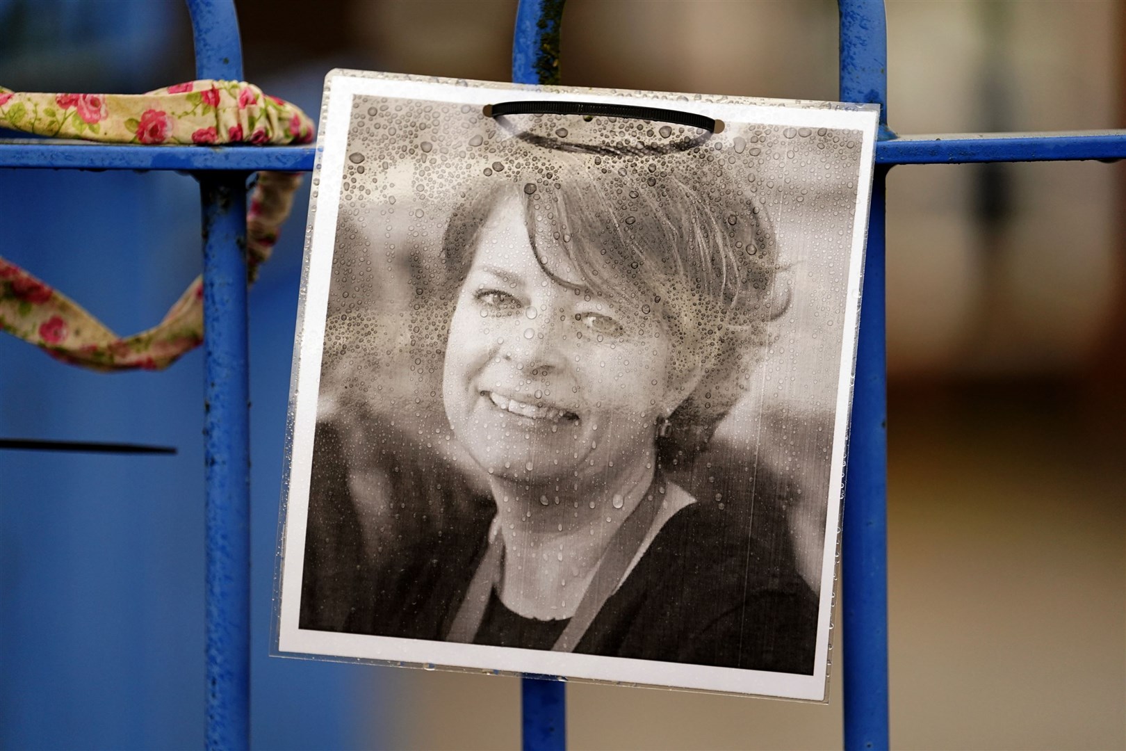 A photograph of headteacher Ruth Perry attached to the railings of John Rankin Schools in Newbury, Berkshire (Andrew Matthews/PA)