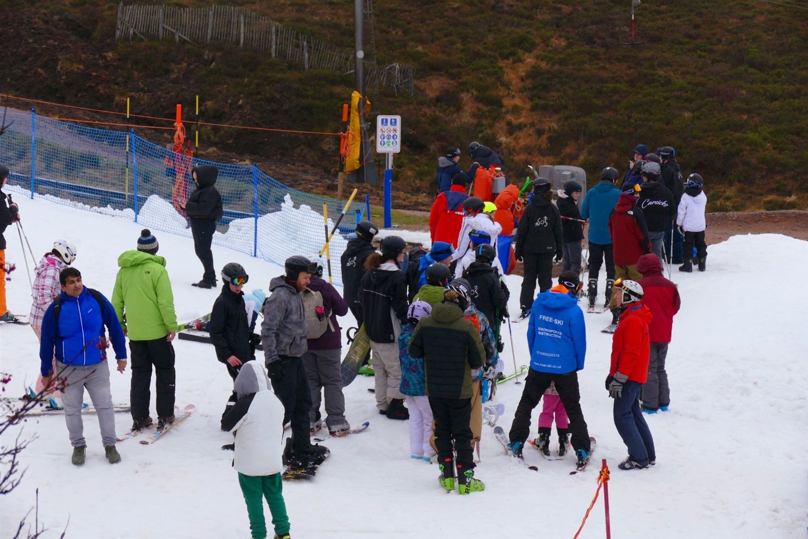 CROWDED SLOPE: One of the gatherings on a rare patch of white today.